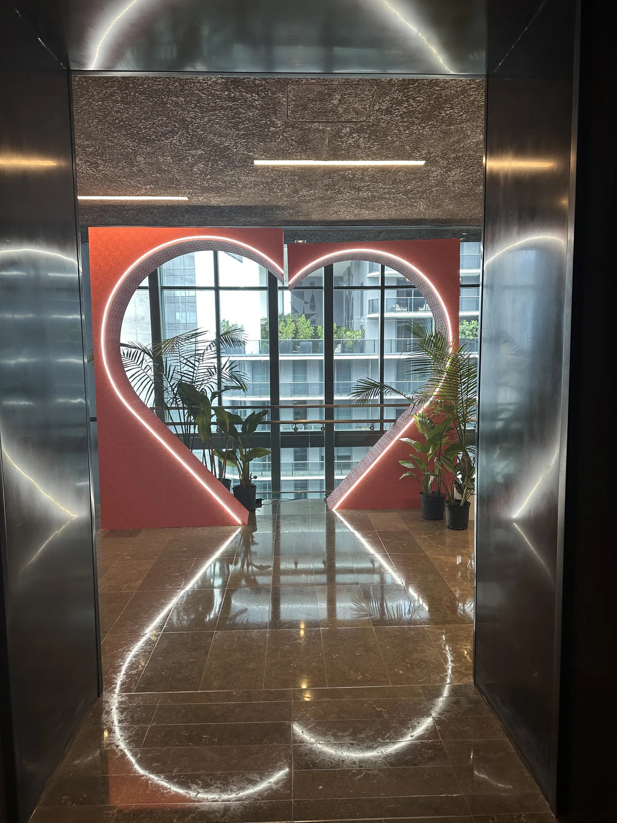 Sculptural red heart installation in a contemporary interior
