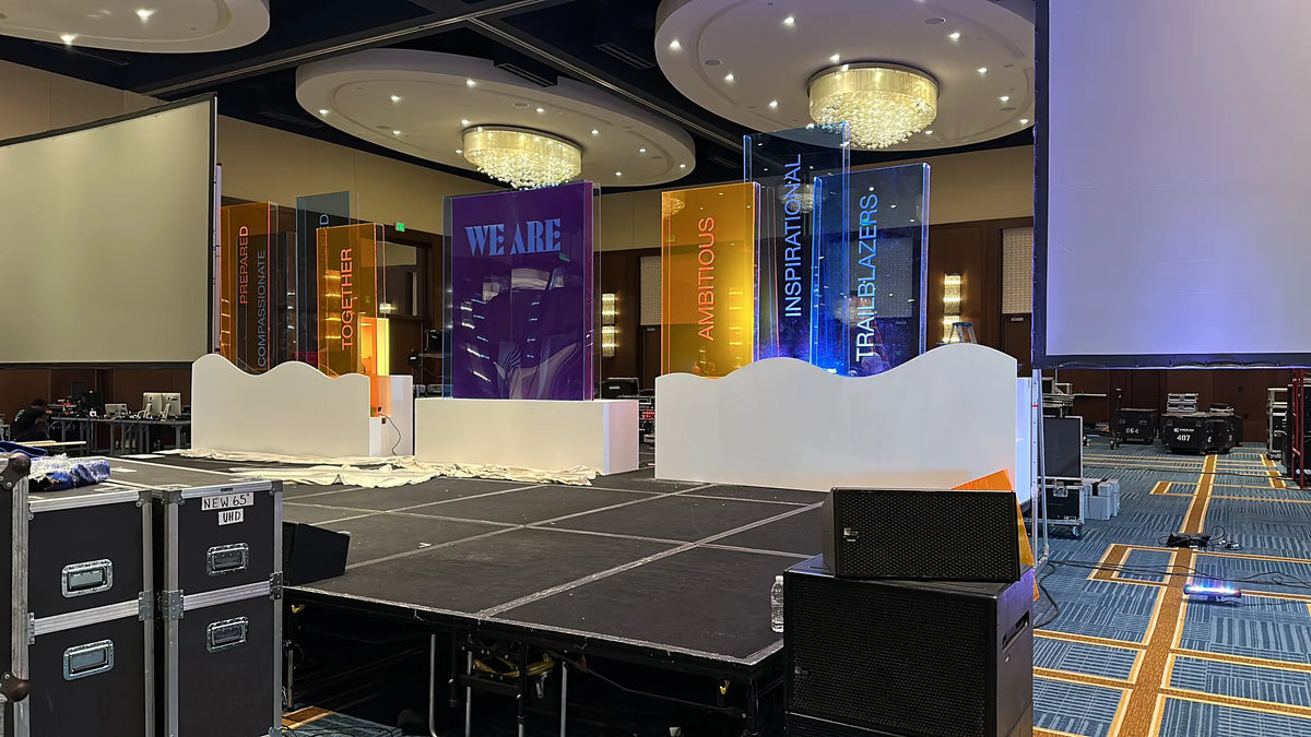 Branded conference stage prepared for a live audience