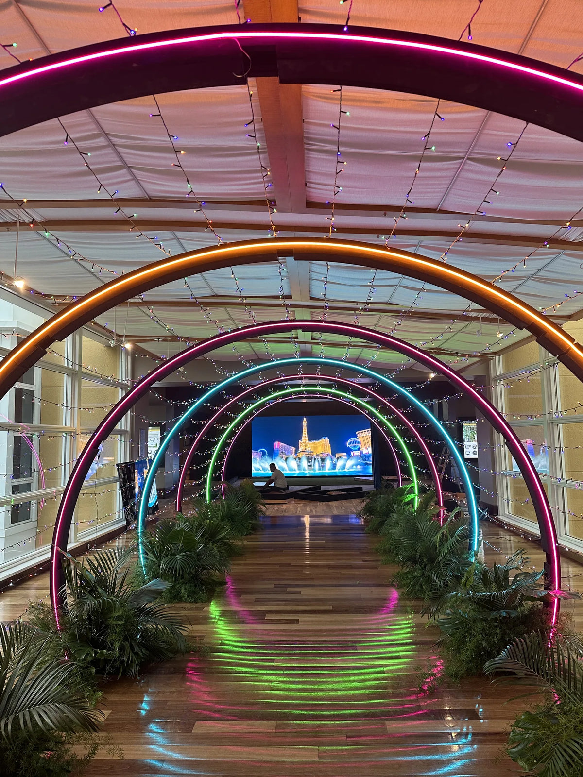 Immersive illuminated tunnel leading guests into an event