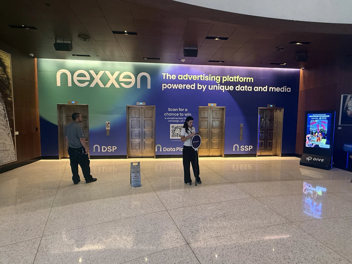 Nexxen environmental graphics wrapping a conference elevator lobby